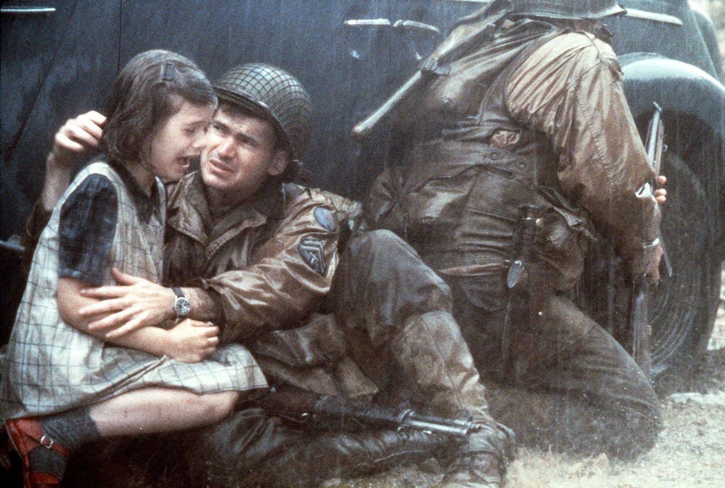 
Corporal Upham, played by Jeremy Davies, tries to comfort a terrified little girl in this 1998 publicity photo from the World War II action drama "Saving Private Ryan."   The film, directed by Steven Spielberg, deals with gritty realism and wartime violence, part of a renewed Hollywood interest in the last "good war." (AP Photo/David James, DreamWorks, HO) <%% 0 PICTURE_OK HEADER_OK 0 120 %%>