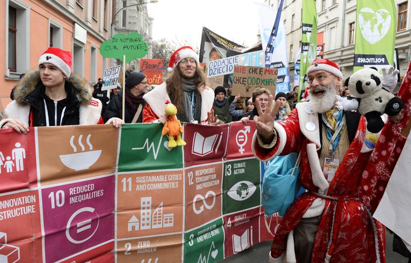 Climate activists attend the March for Climate in a protest against global warming in Katowice, Poland, Saturday, Dec. 8, 2018, as the COP24 UN Climate Change Conference takes place in the city. (AP Photo/Alik Keplicz)