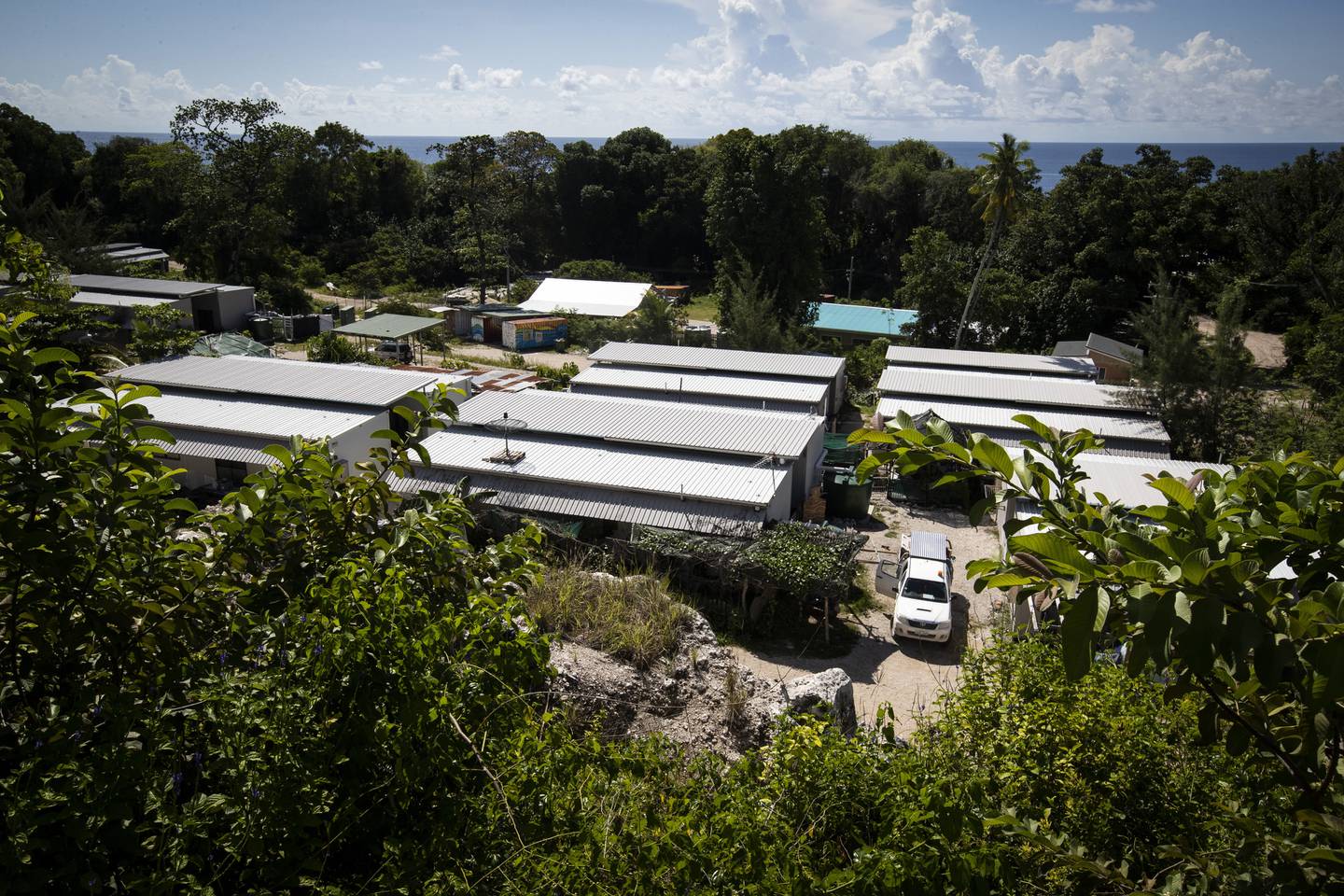 FILE - This Sept. 4, 2018, file photo shows Nibok refugee settlement on Nauru. Australia announced on Sunday, Feb. 3, 2019 that the last child refugees held on the Pacific atoll of Nauru will soon the sent to the United States, ending the banishment of children under the government's harsh asylum-seeker policy as elections loom. (Jason Oxenham/Pool Photo via AP, File)