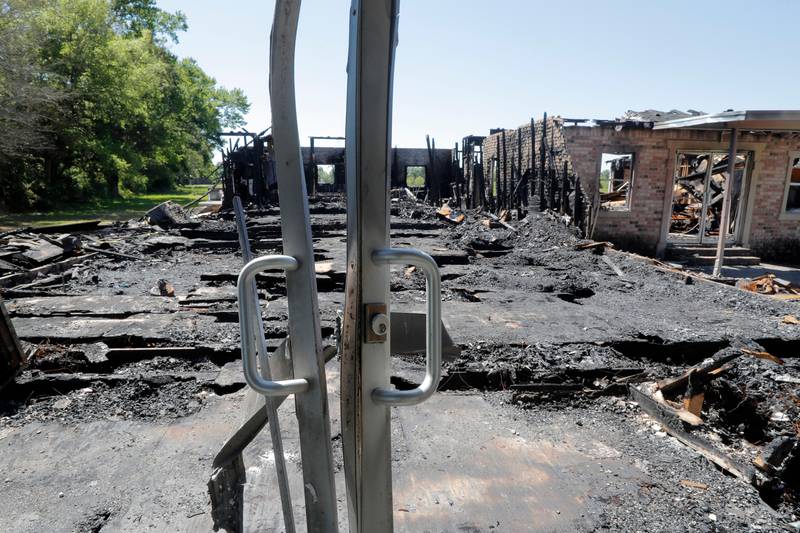 The burnt ruins of the Greater Union Baptist Church, one of three that recently burned down in St. Landry Parish, are seen in Opelousas, La., Wednesday, April 10, 2019. The first fire occurred March 26 at St. Mary Baptist Church in Port Barre, and the second happened April 2 at Greater Union Baptist Church in Opelousas. On April 4, Mount Pleasant caught fire. (AP Photo/Gerald Herbert)