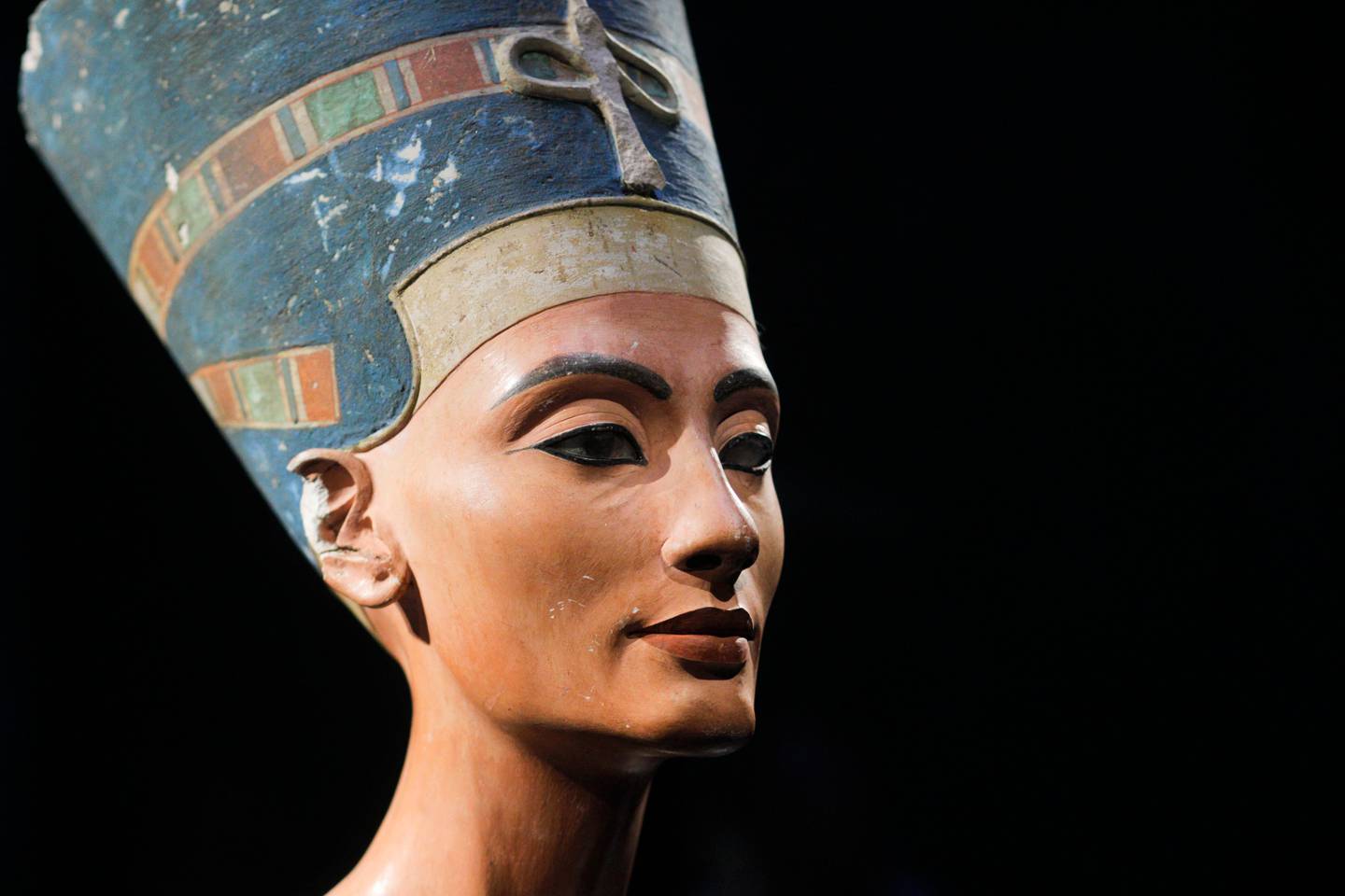 FILE - In this Oct. 15, 2009 file photo, the 3,300-year-old bust of Queen Nefertiti is seen at the "Neues Museum", New Museum, on the so-called Museum Island during a media preview in Berlin, Germany. Egypt's antiquities chief said Sunday, Dec. 20, 2009 he will formally demand the return of the 3,300-year old bust of Queen Nefertiti kept in a Berlin museum after confirming it was sneaked out of Cairo through fraudulent documents. (AP Photo/Markus Schreiber, File)