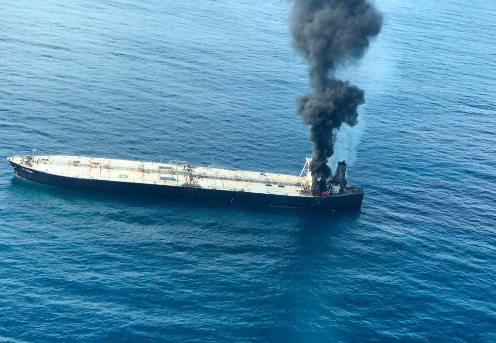 This photo released by Sri Lankan Air Force shows smoke rising after a fire broke out on a Panama-registered oil tanker about 38 nautical miles (70 kilometers) east of Sri Lanka, Thursday, Sept.3, 2020. (Sri Lankan Air Force via AP)