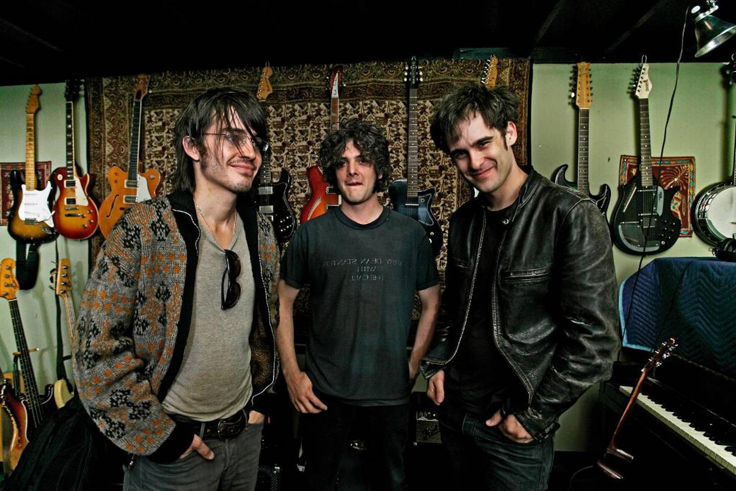 The band is comprised of Peter Hayes (guitar, bass, vocals) middle; Robert Levon Been (guitar, bass, vocals) right, and Nick Jago (drums/percussion) left.