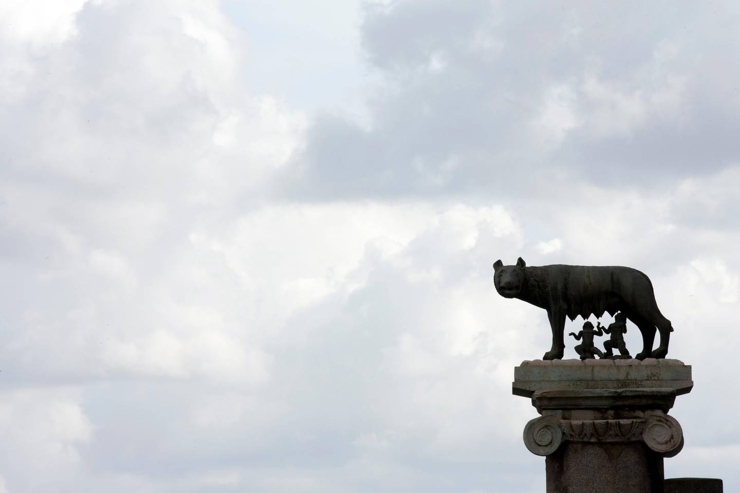 Clouds float over the bronze statue of a she-wolf nursing the infants Romulus and Remus, symbol of Rome, outside Rome's Campidoglio Capitol Hill, Thursday, Oct. 8, 2015. Rome's embattled mayor, Ignazio Marino, was under mounting pressure Thursday to resign following a scandal over his expense accounts that threatened to be the final straw in a months-long campaign by his opponents to get him out of office. (AP Photo/Alessandra Tarantino)