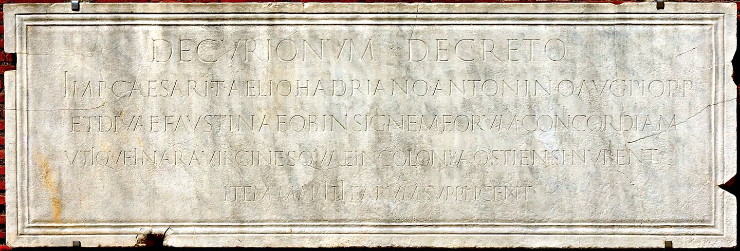 Inscription (CIL 14.5326) from Ostia Antica recording a decree that newlyweds are to pray and sacrifice before the altar to the imperial couple Antoninus Pius and Faustina as exemplifying Concordia, marital harmony.