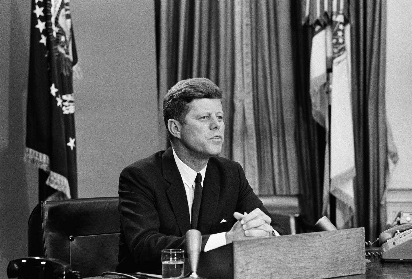 President John Kennedy as he made a nation-wide televised broadcast on civil rights in the White House, June 11, 1963.  His talk climaxed a day during which Alabama Gov. George  Wallace defied a Federal Court order to admit two black students to the University of Alabama at Tuscaloosa.  Wallace withdrew after the National Guard was federalized and placed on duty on the university campus.  The president asked the American people for help in ending racial discrimination and termed the fulfillment of Negro rights, a moral issue. (AP Photo/Charles Gorry)