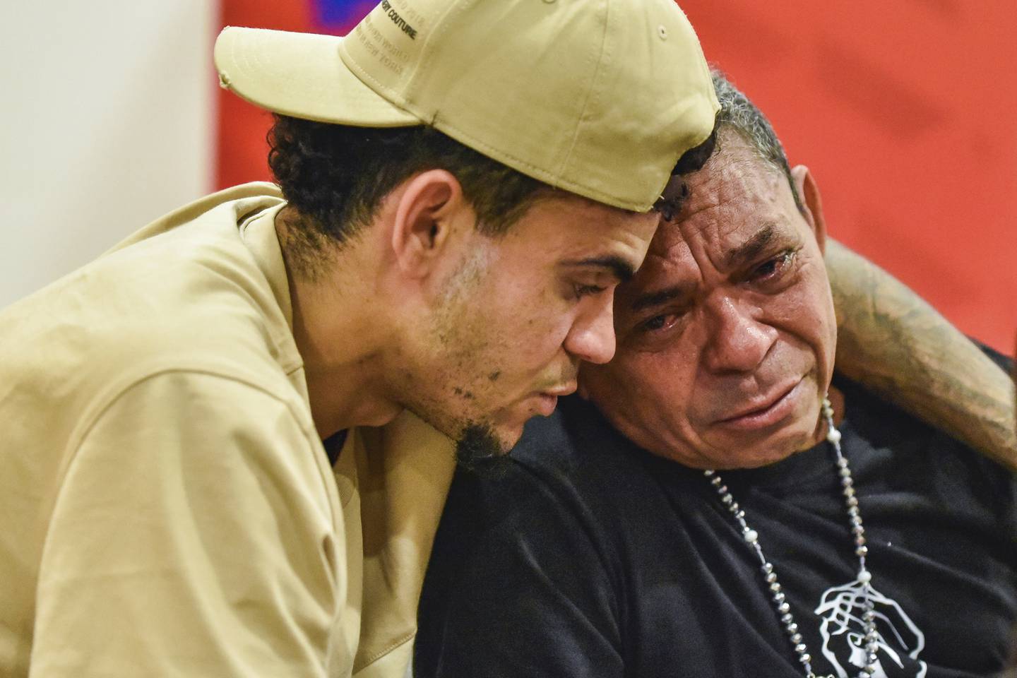 This photo released by Colombia's Football Federation shows Liverpool soccer player Luis Diaz, left, reuniting with his father Luis Manuel Díaz, days after his father was released from his kidnappers, in Barranquilla, Colombia, Tuesday, Nov. 14, 2023. The soccer player's father was kidnapped in northern Colombia by a unit of a guerrilla group in late October and released the previous week week. (Colombia Football Federation via AP)