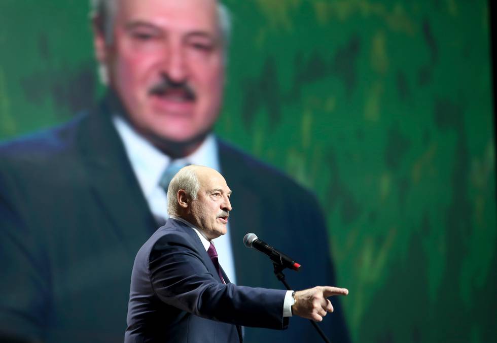 Belarusian President Alexander Lukashenko gestures as he addresses a women's forum in Minsk, Belarus, Thursday, Sept. 17, 2020. President Alexander Lukashenko's decision to close the borders with Poland and Lithuania underlines his repeated claim that the massive wave of protests is driven by the West and comes amid increasing criticism from the United States and the European Union. (TUT.by via AP)