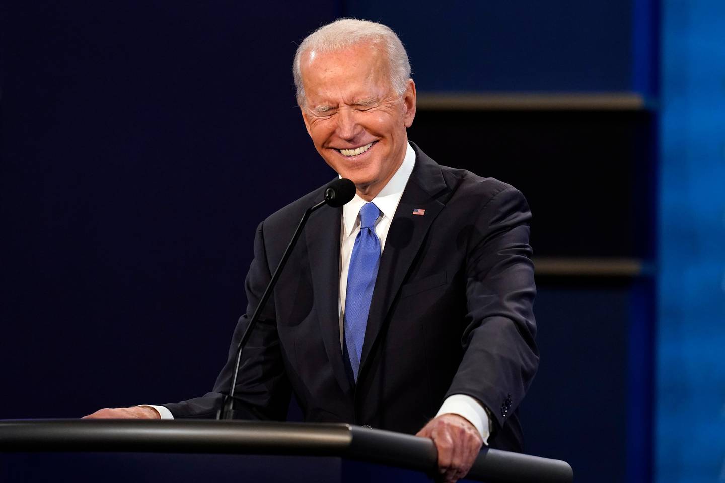Democratic presidential candidate former Vice President Joe Biden laughs during the second and final presidential debate Thursday, Oct. 22, 2020, at Belmont University in Nashville, Tenn., with President Donald Trump. (AP Photo/Patrick Semansky)