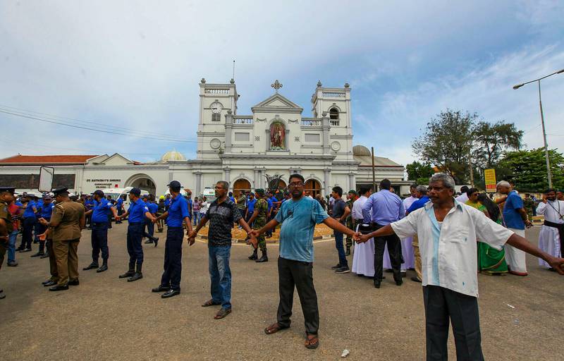 Sri Lankan army soldiers secure the area around St. Anthony's Shrine after a blast in Colombo, Sri Lanka, Sunday, April 21, 2019. More than hundred people were killed and hundreds more hospitalized from injuries in near simultaneous blasts that rocked three churches and three luxury hotels in Sri Lanka on Easter Sunday, a security official told The Associated Press, in the biggest violence in the South Asian country since its civil war ended a decade ago. (AP Photo/ Rohan Karunarathne )