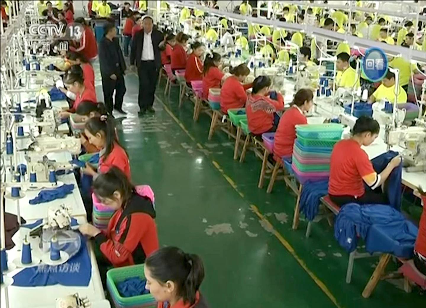 FILE - In this image made from undated, file video footage run by China's CCTV via AP Video, Muslim trainees work in a garment factory at the Hotan Vocational Education and Training Center in Hotan, Xinjiang, northwest China. China on Tuesday, Sept. 22, 2020, lashed out at the passage of a bill by the U.S. House of Representatives that threatens sanctions over the alleged use of forced labor in Chinas Xinjiang region, calling the accusation a lie. (CCTV via AP Video, File)