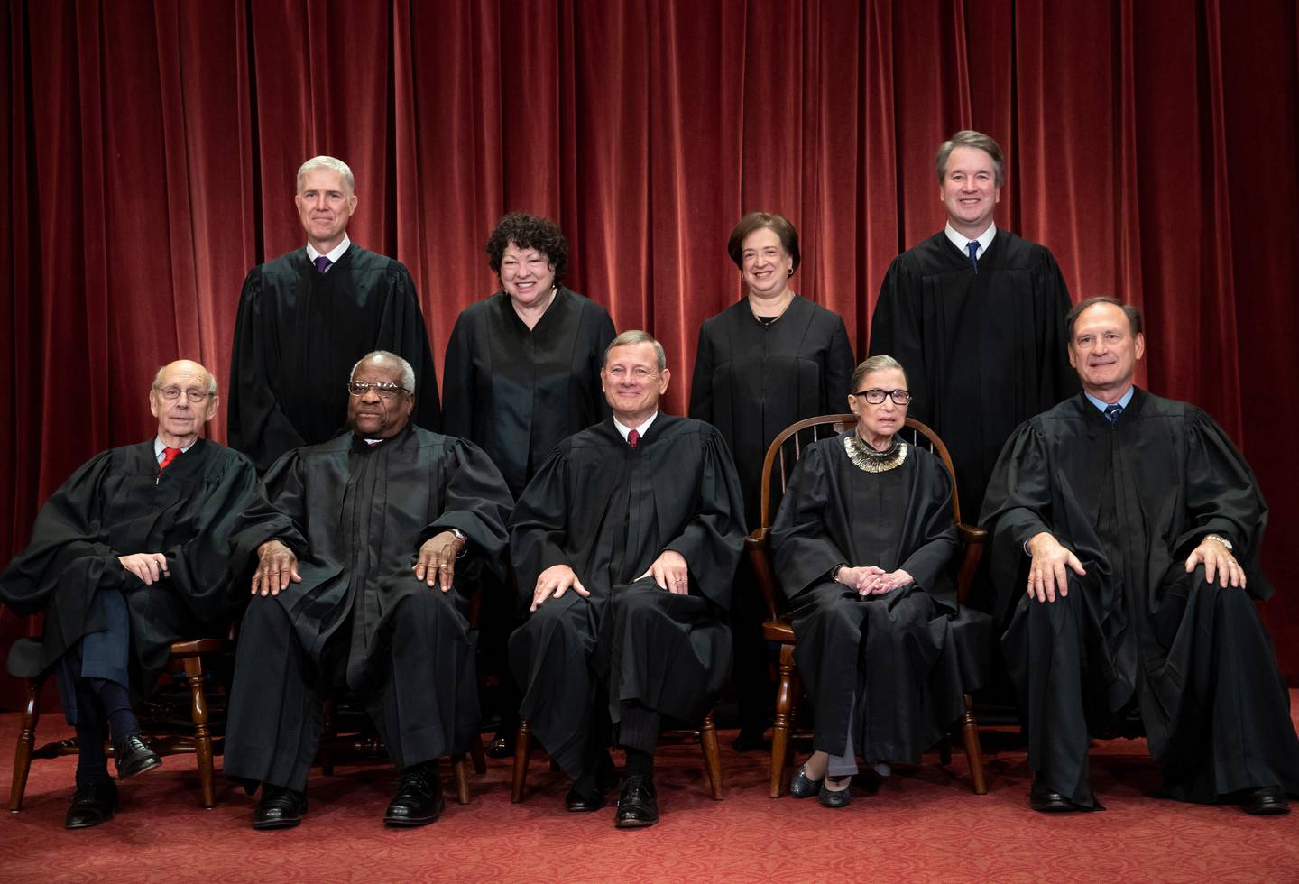 FILE - In this Nov. 30, 2018, file photo, the justices of the U.S. Supreme Court gather for a formal group portrait to include the new Associate Justice, top row, far right, at the Supreme Court building in Washington. Seated from left: Associate Justice Stephen Breyer, Associate Justice Clarence Thomas, Chief Justice of the United States John G. Roberts, Associate Justice Ruth Bader Ginsburg and Associate Justice Samuel Alito Jr. Standing behind from left: Associate Justice Neil Gorsuch, Associate Justice Sonia Sotomayor, Associate Justice Elena Kagan and Associate Justice Brett M. Kavanaugh. Its the time of the year when Supreme Court justices can get testy, but they might have to find a new way to show it. (AP Photo/J. Scott Applewhite, File)