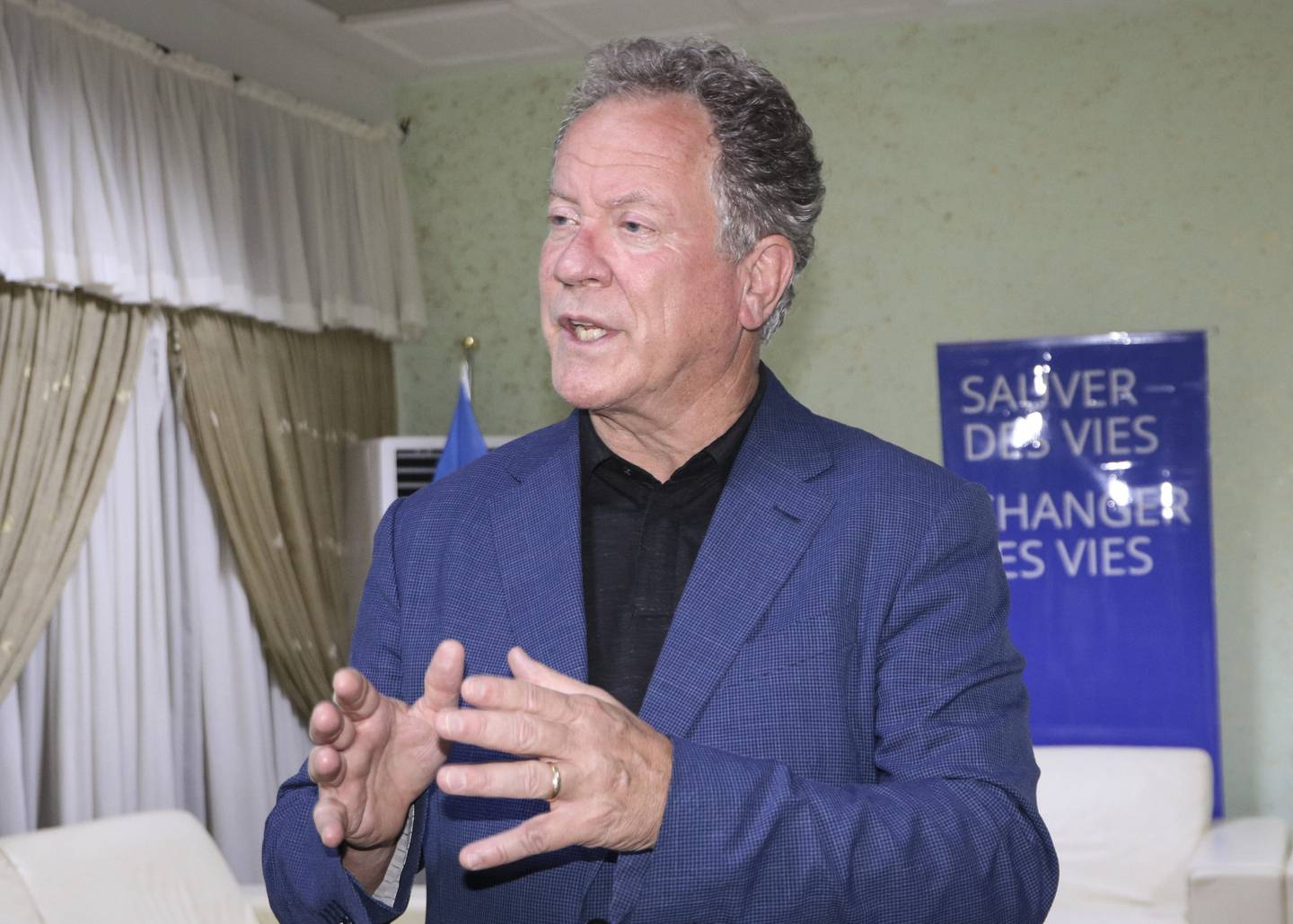 FILE - In this Oct. 9, 2020 file photo, World Food Program (WFP) Executive Director David Beasley speaks to journalists about the organization's Nobel Peace Prize win, at the airport in Ouagadougou, Burkina Faso. After a visit to Yemen Beasly warned that his underfunded organization may be forced seek hundreds of millions of dollars in private donations in a desperate bid to stave off widespread famine in the coming months. Beasley told The Associated Press in an interview Wednesday March 10, 2021, that conditions in war-wrecked Yemen are hell. (AP Photo/Sam Mednick, File)