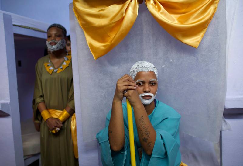 Female inmates in costume wait to perform a Bible story during Nelson Hungria Prison's annual Christmas event before fellow inmates and jail staff in Rio de Janeiro, Brazil, Thursday, Dec. 13, 2018. Inmates serving time for offenses from burglary to homicide spent weeks decking out their cell blocks with handmade decorations and planning religious related performances. (AP Photo/Silvia Izquierdo)