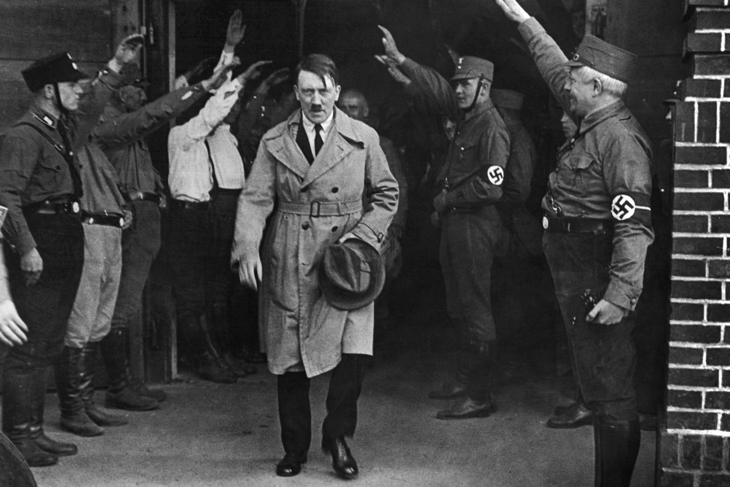 FILE - In this Dec. 5, 1931 file photo Adolf Hitler, leader of the National Socialists, leaves the party's Munich, Germany headquarters. On Friday, June 12, 2020, The Associated Press reported on stories circulating online incorrectly asserting that Hitler defunded the police and installed his own enforcers. Gavriel D. Rosenfeld, a historian and history professor at Fairfield University says, "Lets just say the Nazis did everything BUT defund the police, noting that Nazis made the police one of the chief recipients of state financial support aside from military spending. (AP Photo/File)