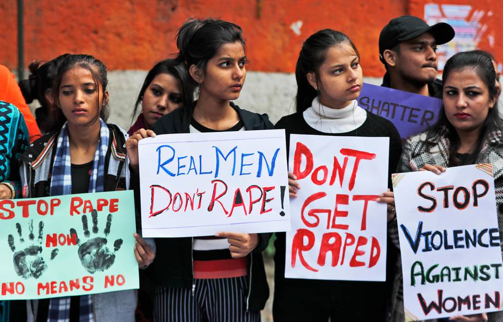 Women activists hold banners and participate in a protest demanding justice in the case of a veterinarian who was gang-raped and killed last week, in New Delhi, India, Tuesday, Dec. 3, 2019. The burned body of the 27-year-old woman was found Thursday morning by a passer-by in an underpass in the southern city of Hyderabad after she went missing the previous night. (AP Photo/Manish Swarup)