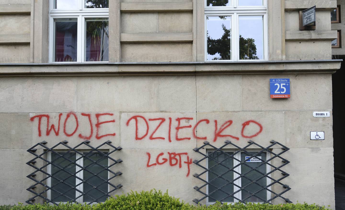 The names of young LGBT people who have died from suicide are shown spray painted on the Education Ministry building, an act of protest by LGBT activists, in Warsaw, Poland, Wednesday, Sept. 30, 2020. LGBT rights are the focus of a culture clash in Poland. A growing LGBT rights movement has been met with a backlash from the conservative government, church and many local communities. While President Donald Trump sees an ally in Poland on many issues, his ambassador this week said Poland's conservative government is on the "wrong side of history" on this issue.(AP Photo/Czarek Sokolowski)