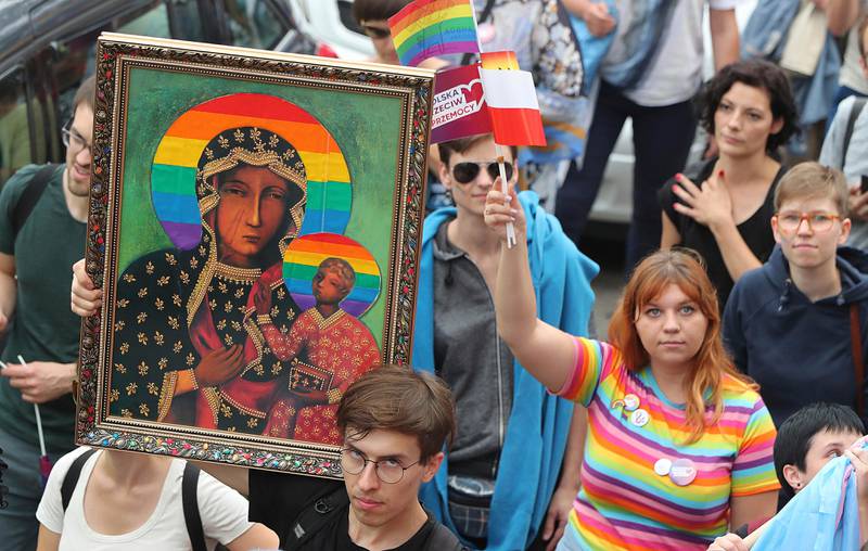 LGBT activists and their supporters gather for the first-ever pride parade in the central city of Plock, Poland, on Saturday, Aug. 10, 2019. The parade comes as the country finds itself bitterly divided over the growing visibility of the LGBT issue and as the government and powerful Catholic church denounce gay rights as a threat to society. (AP Photo/Czarek Sokolowski)