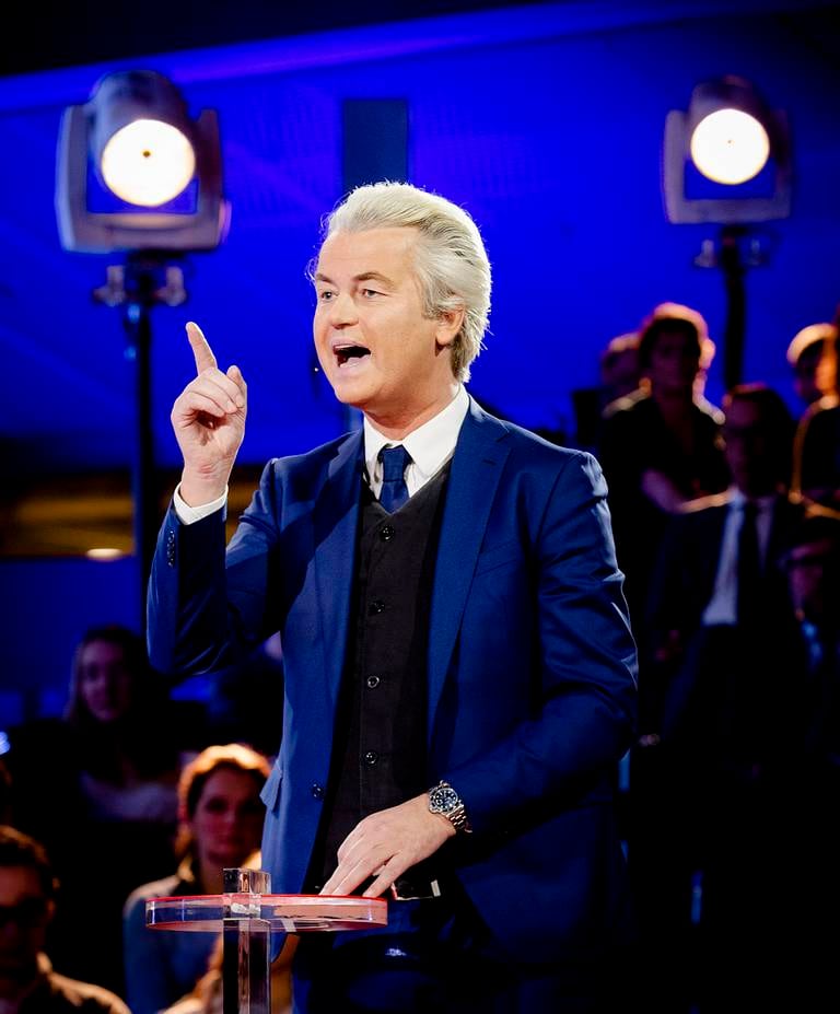PVV party leader and firebrand anti-Islam lawmaker Geert Wilders gestures during the closing debate at parliament in The Hague, Netherlands, Tuesday, March 14, 2017. Amid unprecedented international attention, the Dutch go to the polls Wednesday in a parliamentary election that is seen as a bellwether for the future of populism in a year of crucial votes in Europe. (Robin van Lonkhuijsen ANP POOL via AP)