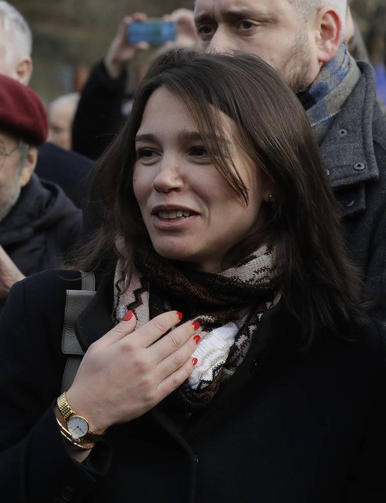 Zhanna Nemtsova, the daughter of Russian opposition figure Boris Nemtsov smiles during a ceremony of unveiling a sign renaming the square where the Russian embassy is located in Prague, Czech Republic, Thursday Feb. 27, 2020, named after the late Russian opposition leader Boris Nemtsov. Nemtsov was gunned down outside the Kremlin 5 years ago. (AP Photo/Petr David Josek)