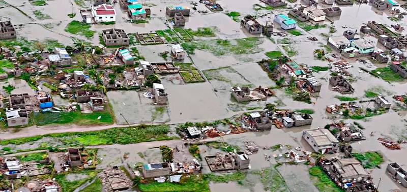 This image made available by International Federation of Red Cross and Red Crescent Societies (IFRC) on Monday March 18, 2019, shows an aerial view from a helicopter of flooding in Beira, Mozambique. The Red Cross says that as much as 90 percent of Mozambique's central port city of Beira has been damaged or destroyed by tropical Cyclone Idai. (Caroline Haga/International Federation of Red Cross and Red Crescent Societies (IFRC) via AP)