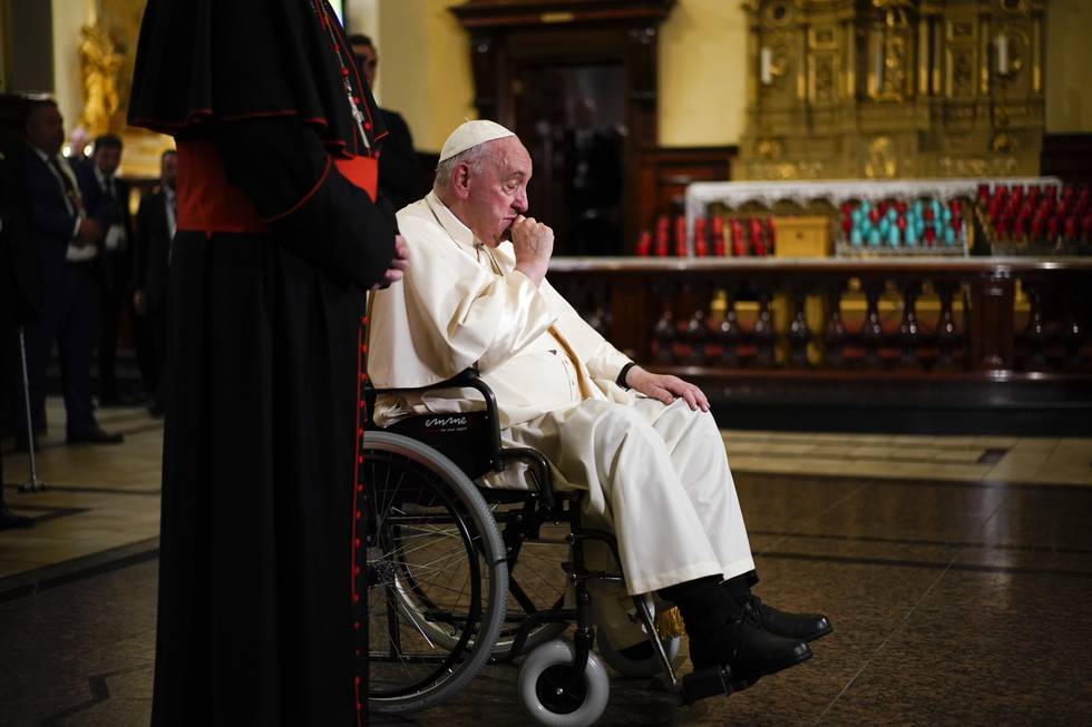 Pope Francis prays by the remains of Saint Francois De Laval after presiding over a vespers service at the Cathedral-Basilica of Notre Dame de Quebec, Thursday, July 28, 2022, in Quebec City, Quebec. Pope Francis is on a "penitential" six-day visit to Canada to beg forgiveness from survivors of the country's residential schools, where Catholic missionaries contributed to the "cultural genocide" of generations of Indigenous children by trying to stamp out their languages, cultures and traditions. (AP Photo/John Locher)