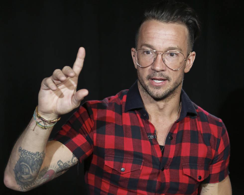 FILE - Carl Lentz appears during an interview on Oct. 23, 2017, in New York. Lentz, the pastor from global megachurch Hillsong, who once ministered to Justin Bieber and a bevy of other celebrities and sports stars, has been fired. He acknowledged on Instagram that he cheated on his wife. (AP Photo/Bebeto Matthews, File)