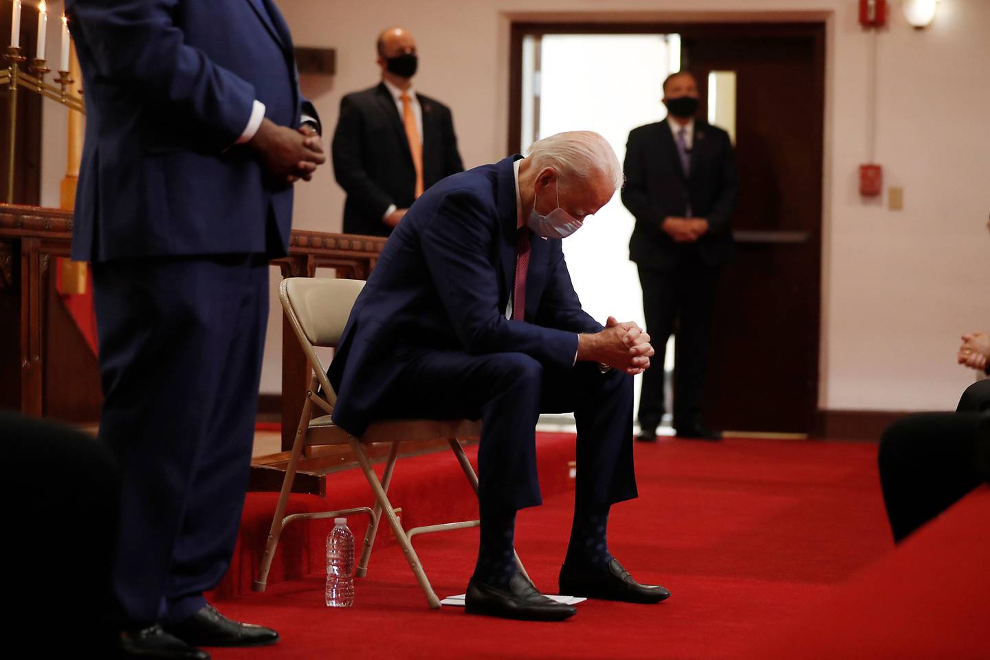 Democratic presidential candidate, former Vice President Joe Biden bows his head in prayer as he visits Bethel AME Church in Wilmington, Del., Monday, June 1, 2020. (AP Photo/Andrew Harnik)