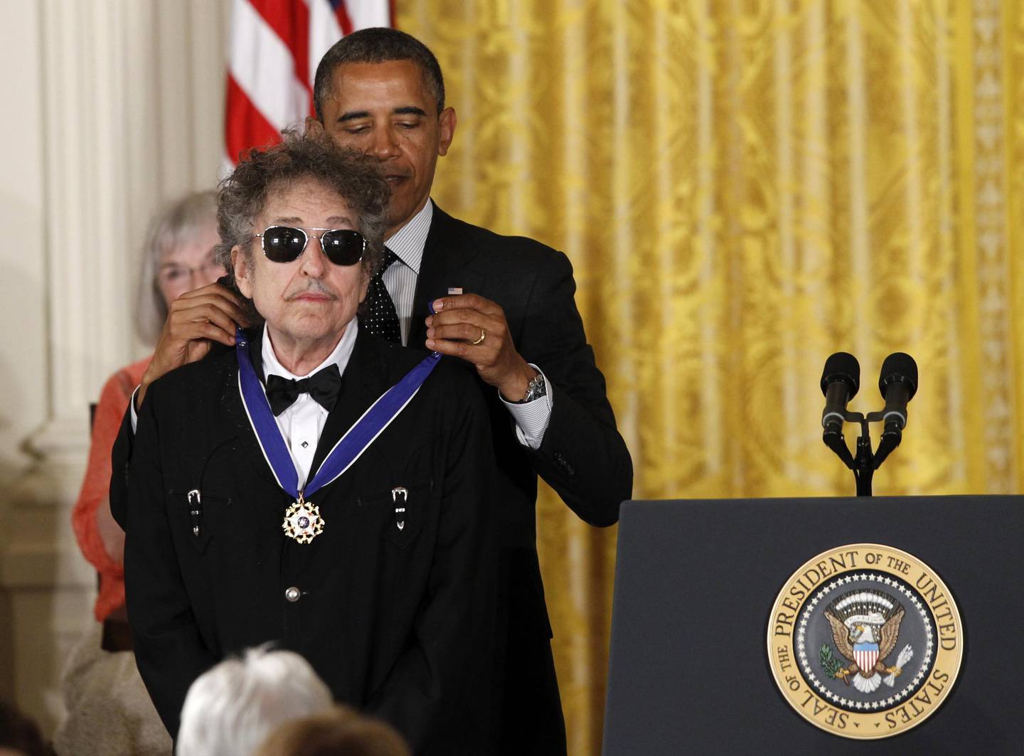 President Barack Obama presents rock legend Bob Dylan with a Medal of Freedom,  Tuesday, May 29, 2012, during a ceremony at the White House in Washington.  (AP Photo/Charles Dharapak)