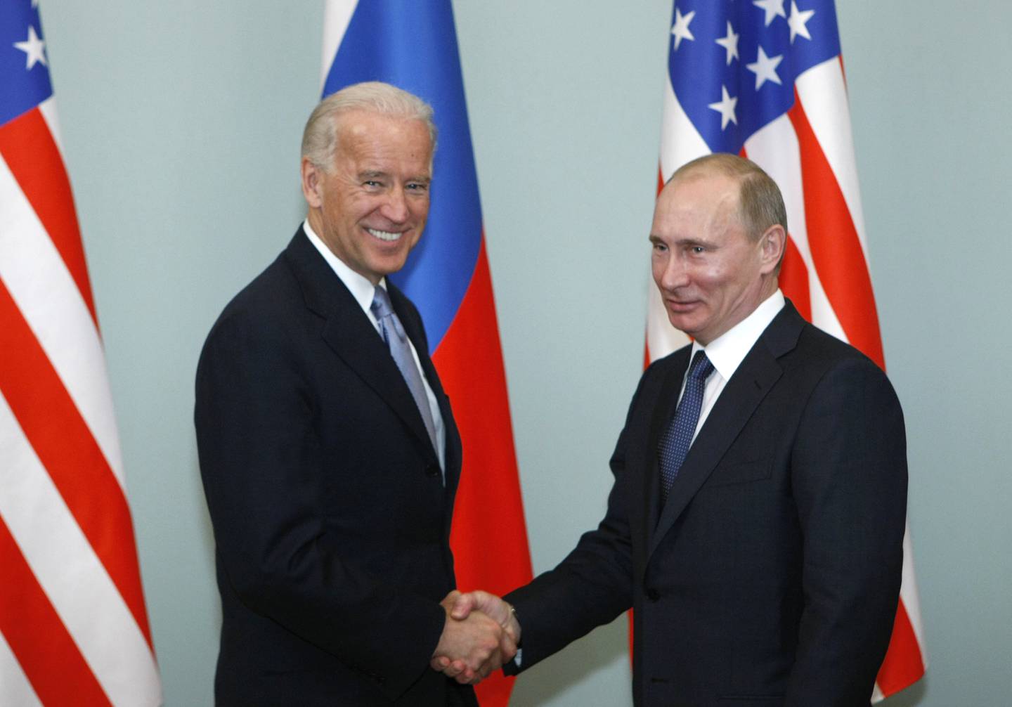 FILE - In this March 10, 2011, file photo, Vice President of the United States Joe Biden, left, shakes hands with Russian Prime Minister Vladimir Putin in Moscow, Russia. Putin wont congratulate President-elect Joe Biden until legal challenges to the U.S. election are resolved and the result is official, the Kremlin announced Monday, Nov. 9, 2020. (AP Photo/Alexander Zemlianichenko, File)