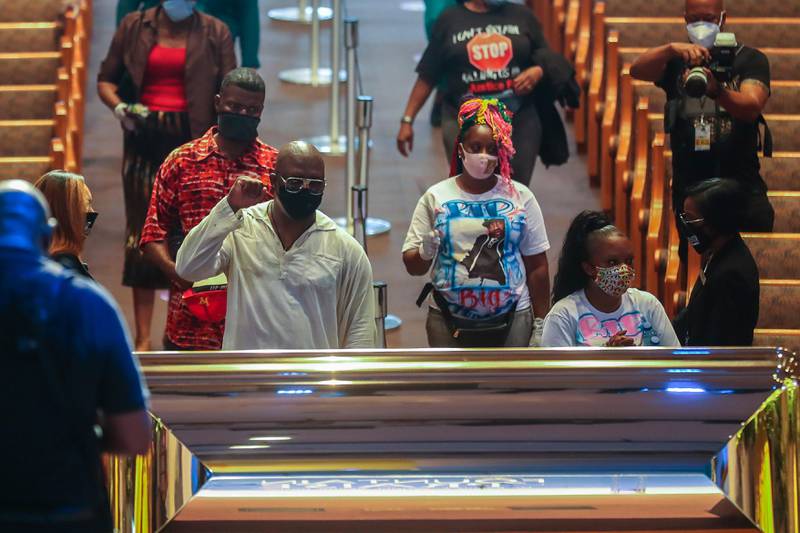 Mourners are guided into the Fountain of Praise Church during a public visitation for George Floyd Monday, June 8, 2020, in Houston. Floyd died after being restrained by Minneapolis Police officers on May 25. (Godofredo A. Vásquez, Houston Chronicle via AP, Pool)