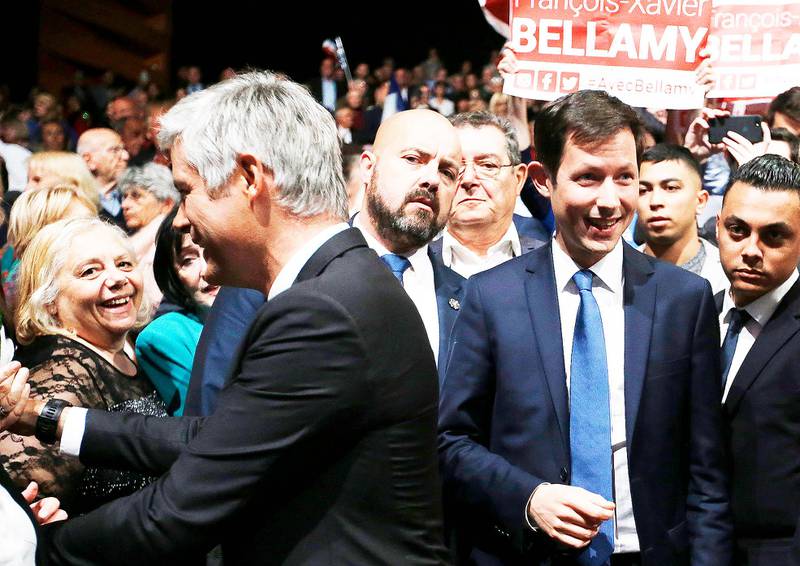 Laurent Wauquiez, left, President of the Republican Party, and Francois-Xavier Bellamy candidate for the European elections meet supporters, during a campaign meeting in Marseille, southern France, Monday, May 6, 2019. The European elections will take place from 23 to May 26. (AP Photo/Claude Paris)