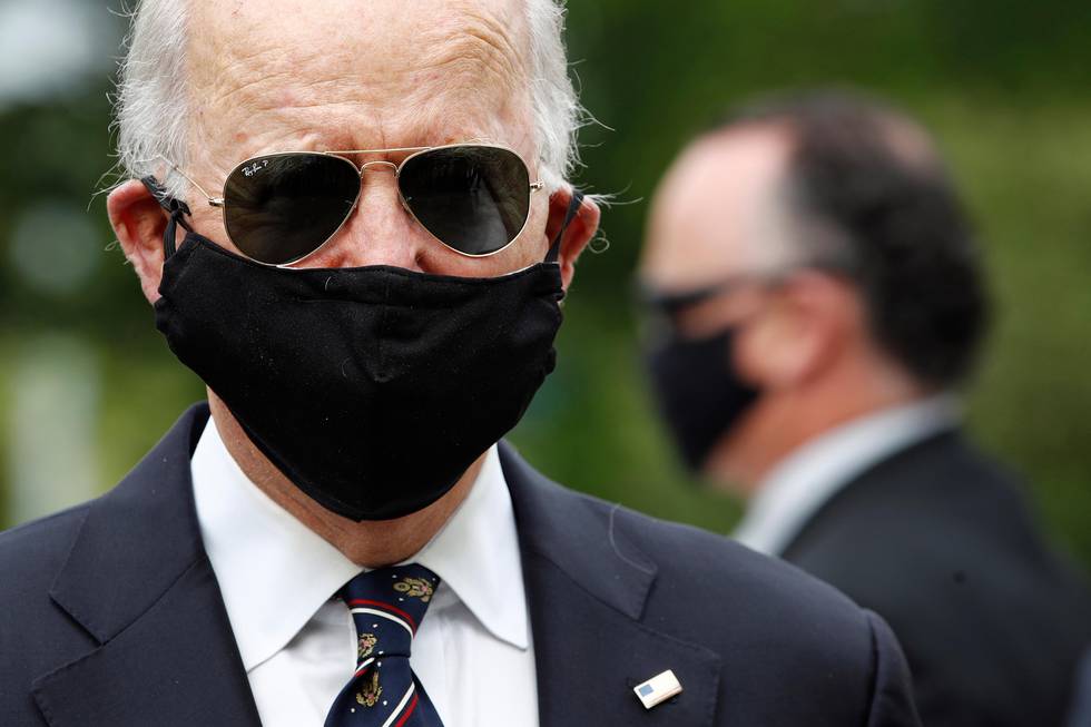 Democratic presidential candidate, former Vice President Joe Biden wears a face mask to protect against the spread of the new coronavirus as he and Jill Biden depart after placing a wreath at the Delaware Memorial Bridge Veterans Memorial Park, Monday, May 25, 2020, in New Castle, Del. (AP Photo/Patrick Semansky)