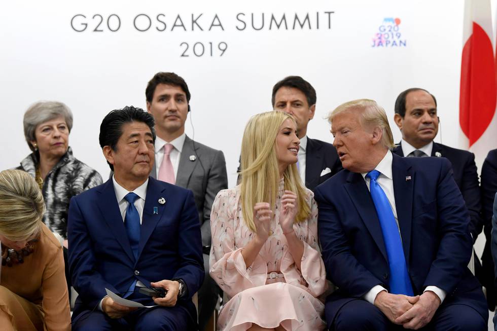 President Donald Trump, right, leans over to talk to Ivanka Trump as they sit next to Japanese Prime Minister Shinzo Abe during a G-20 summit event on women's empowerment in Osaka, Japan, in Osaka, Japan, Saturday, June 29, 2019. (AP Photo/Susan Walsh)