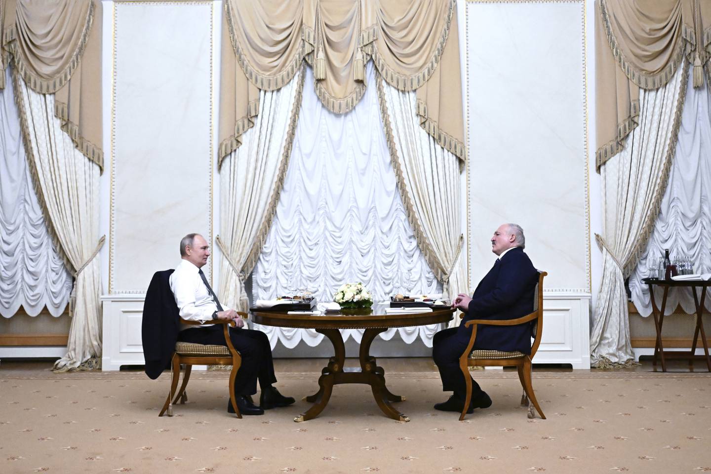 Russian President Vladimir Putin, left, and Belarusian President Alexander Lukashenko talk to each other during their meeting in St. Petersburg, Russia, Sunday, Jan. 28, 2024. (Pavel Bednyakov, Sputnik, Kremlin Pool Photo via AP)