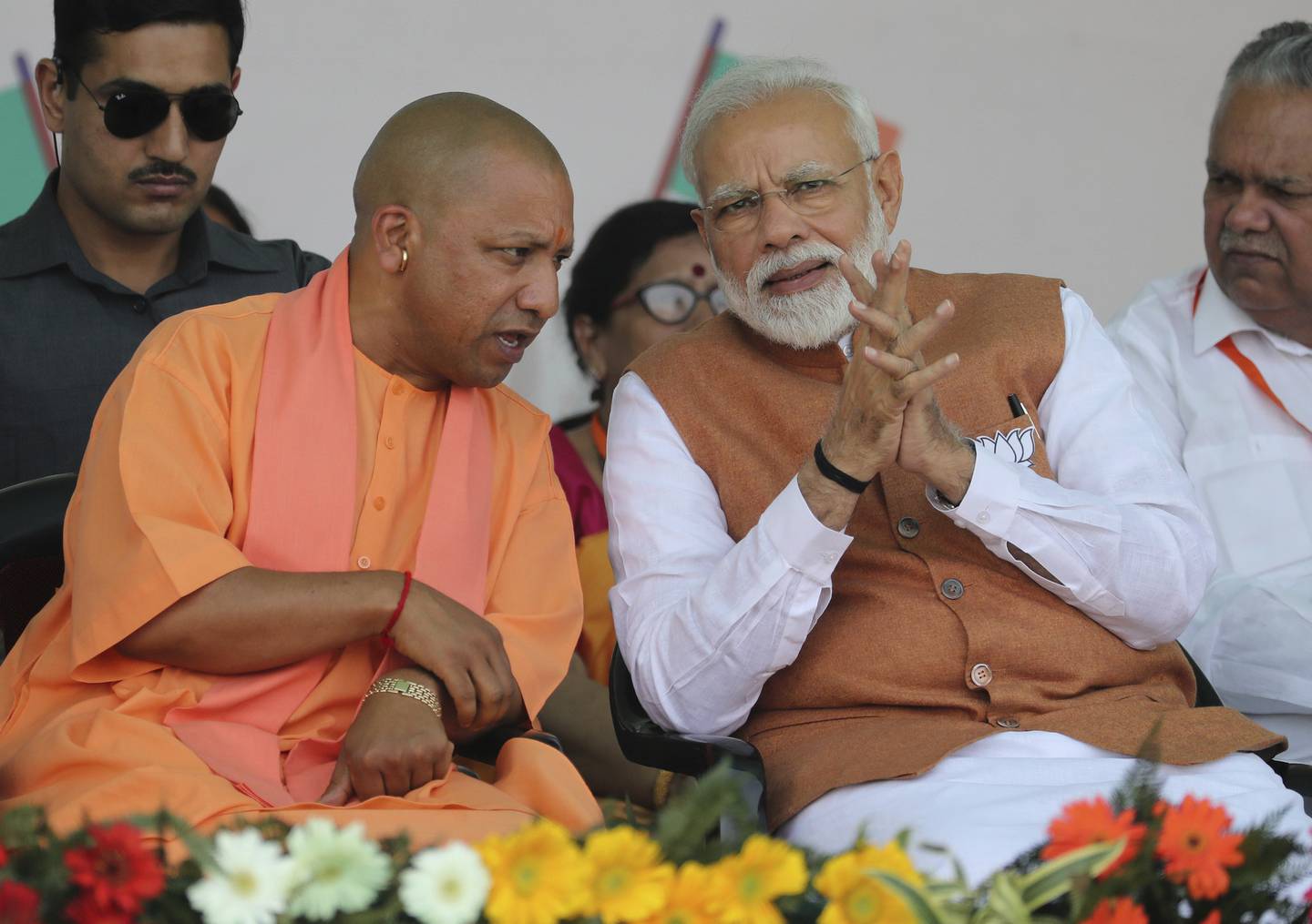FILE- In this March 28, 2019, file photo, Indian Prime Minister Narendra Modi, right, speaks with Chief Minister of Uttar Pradesh state Yogi Adityanath during an election campaign rally in Meerut, India. Indias ruling Hindu nationalist party has approved legislation in Uttar Pradesh, the countrys most populous state, that lays out a prison term of up to 10 years for anyone found guilty of using marriage to force someone to change religion. The decree was passed Tuesday and follows a campaign by Modis Hindu-nationalist Bharatiya Janata Party against interfaith marriages. The party describes such marriages as love jihad, an unproven conspiracy theory used by its leaders and Hindu hard-line groups to accuse Muslim men of converting Hindu women by marriage. (AP Photo/Altaf Qadri, File)