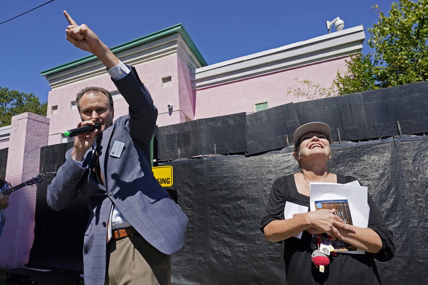 Pastor Jason Dillon of Parkway Pentecostal Church, left, delivers a closing prayer at an anti-abortion protest outside the Jackson Women's Health Organization clinic in Jackson, Miss., Wednesday, Sept. 22, 2021. The clinic is the state's only medical facility able to provide abortions on demand. Abortion rights opponents gathered outside the clinic and gave prayerful support to their cause. (AP Photo/Rogelio V. Solis)