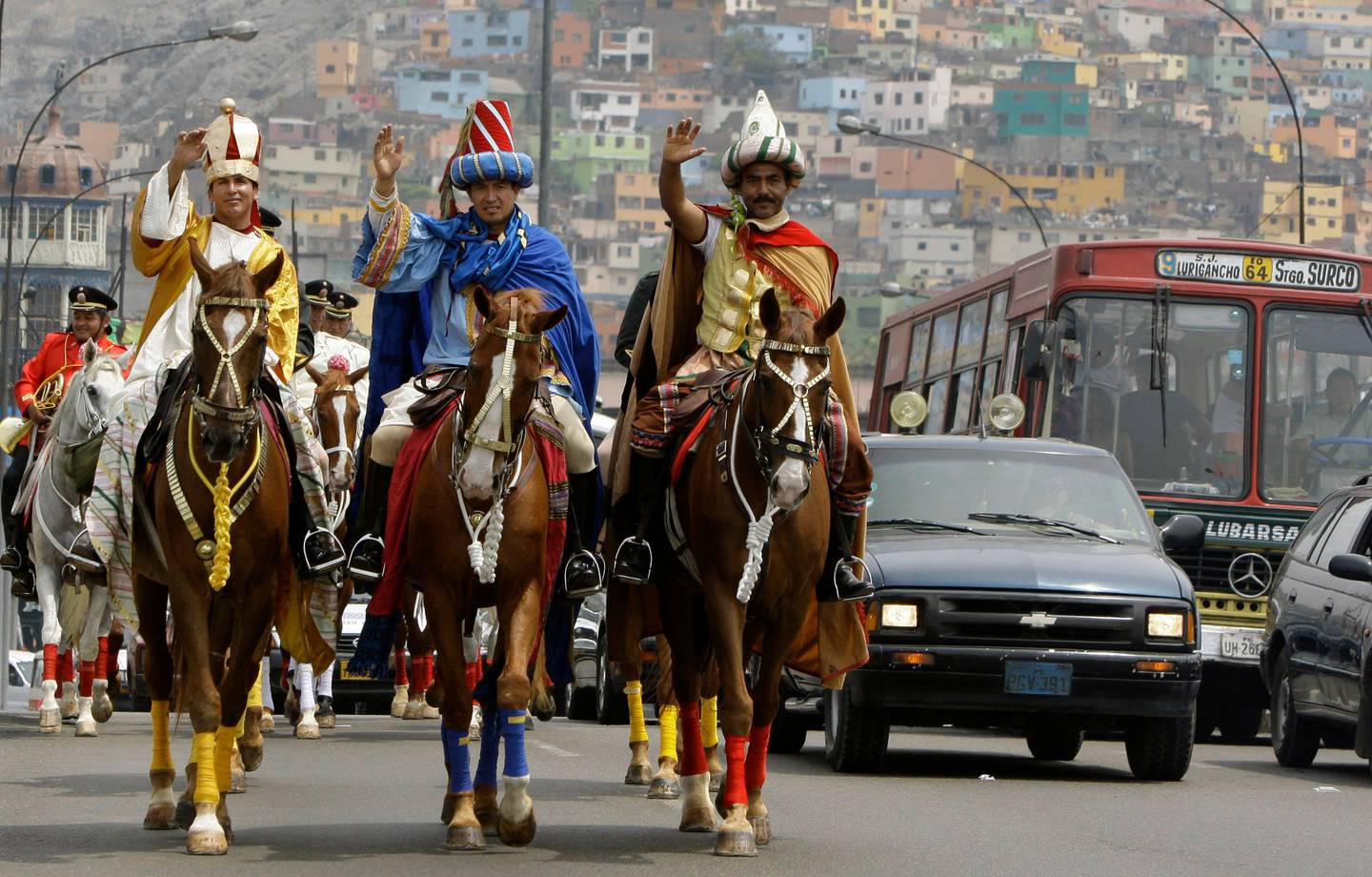 Police officers Juan Polo, left, Tomas Diaz, center, and Pablo Villa dressed as the Three Wise Men or Three Kings parade in Lima, Tuesday, Jan. 6, 2009. On the Epiphany, the Catholic Church marks the visit of the Three Kings or Wise Men, to the baby Jesus in Bethlehem. (AP Photo/Martin Mejia)