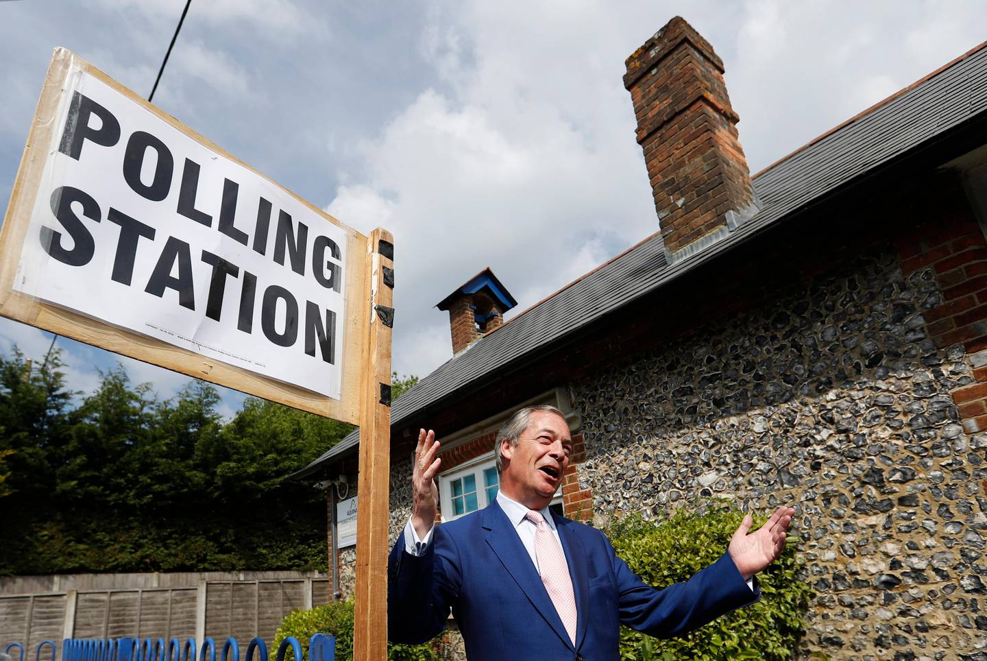 Brexit Party leader Nigel Farage speaks as he stands outside the polling station at Cudham Primary School in Biggin Hill, England, Thursday, May 23, 2019. Some 400 million Europeans from 28 countries head to the polls from Thursday to Sunday to choose their representatives at the European Parliament for the next five years. (AP Photo/Alastair Grant)
