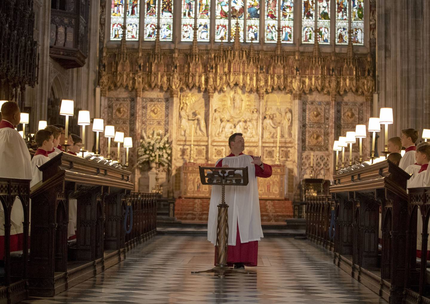 In this picture taken on Monday, May 14, 2018, James Vivian, Director of Music at St George's Chapel, directs the St. George's Chapel Choir during a rehearsal before evensong and ahead of the wedding of Prince Harry and Megan Markle this weekend, in Windsor, England. (Steve Parsons/Pool Photo via AP)