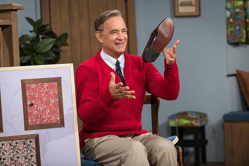 This image released by Sony Pictures shows Tom Hanks as Mister Rogers in a scene from "A Beautiful Day In the Neighborhood. The Mr. Rogers biopic will premiere at the Toronto International Film Festival in September. (Lacey Terrell/Sony-Tristar Pictures via AP)