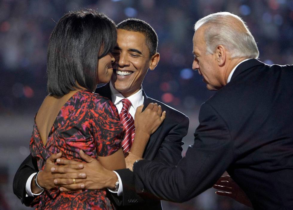 Democratic presidential candidate, Sen. Barack Obama, D-Ill., hugs his wife, Michelle Obama, as his running mate, Sen. Joe Biden, D-Del., leans in after his acceptance speech at the Democratic National Convention at Invesco Field at Mile High in Denver Thursday, Aug. 28, 2008.(AP Photo/Alex Brandon)