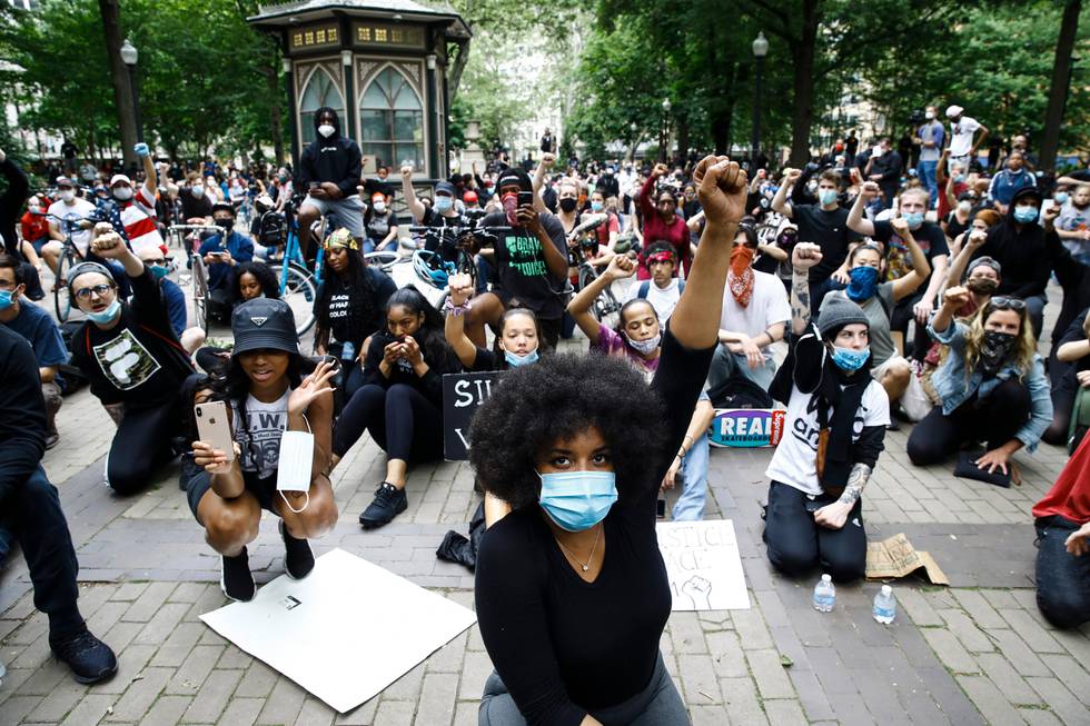 Demonstrators chant Tuesday, June 2, 2020, at Rittenhouse Square in Philadelphia, during a protest over the death of George Floyd, who died May 25 after he was restrained by Minneapolis police. (AP Photo/Matt Rourke)