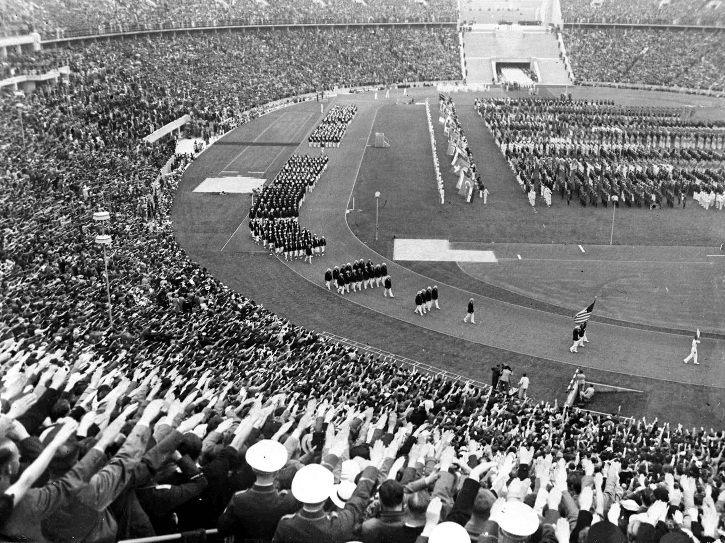 The American team of athletes parade around the Olympic Stadium, in Berlin, Germany, Aug. 1, 1936, during the opening ceremony of the XI Olympic Games. (AP Photo)