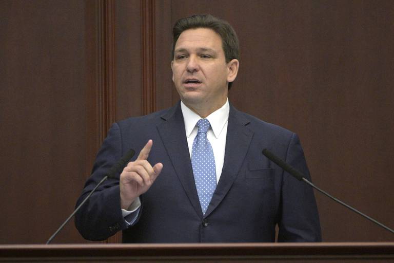 FILE - Florida Gov. Ron DeSantis addresses a joint session of a legislative session, Jan. 11, 2022, in Tallahassee, Fla. Florida’s governor on Thursday, March 25, announced new recommendations called “Buck the CDC” that discourage mask wearing — even though the CDC says the state still has wide areas at high levels of concern. (AP Photo/Phelan M. Ebenhack, File)