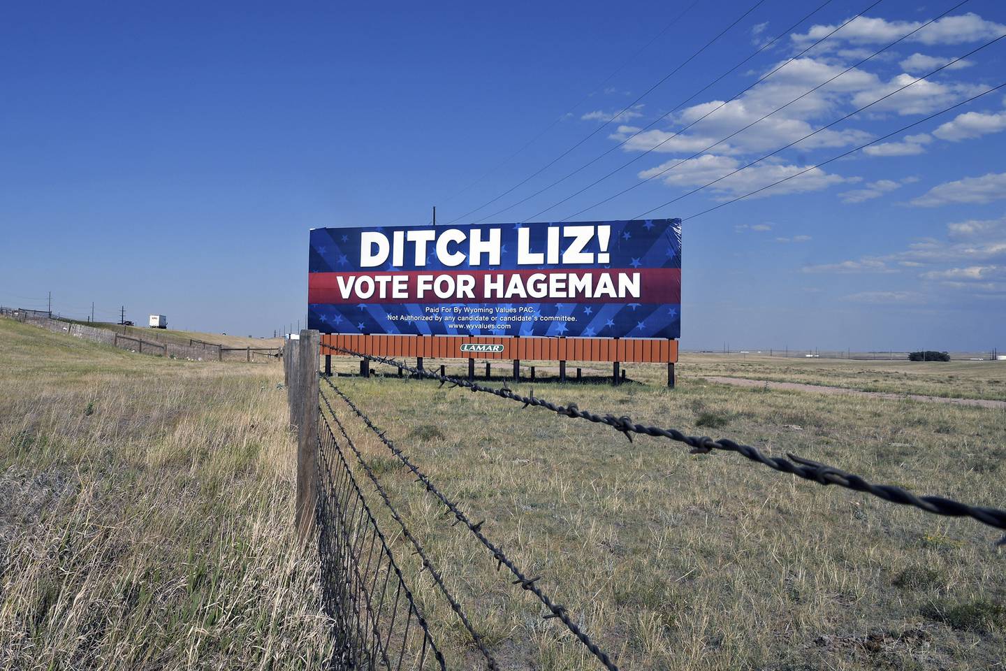 A billboard outside Cheyenne, Wyo., on July 19, 2022, calls on voters to cast their ballots for Harriet Hageman, who is running against incumbent Rep. Liz Cheney, R-Wyo., in the Republican primary election Aug. 16. Rep. Cheney is in the political fight of her life. Wyoming's congresswoman since 2016 is facing a Donald Trump-backed opponent, attorney Harriet Hageman, in the state's upcoming Republican primary. (AP Photo/Thomas Peipert)
