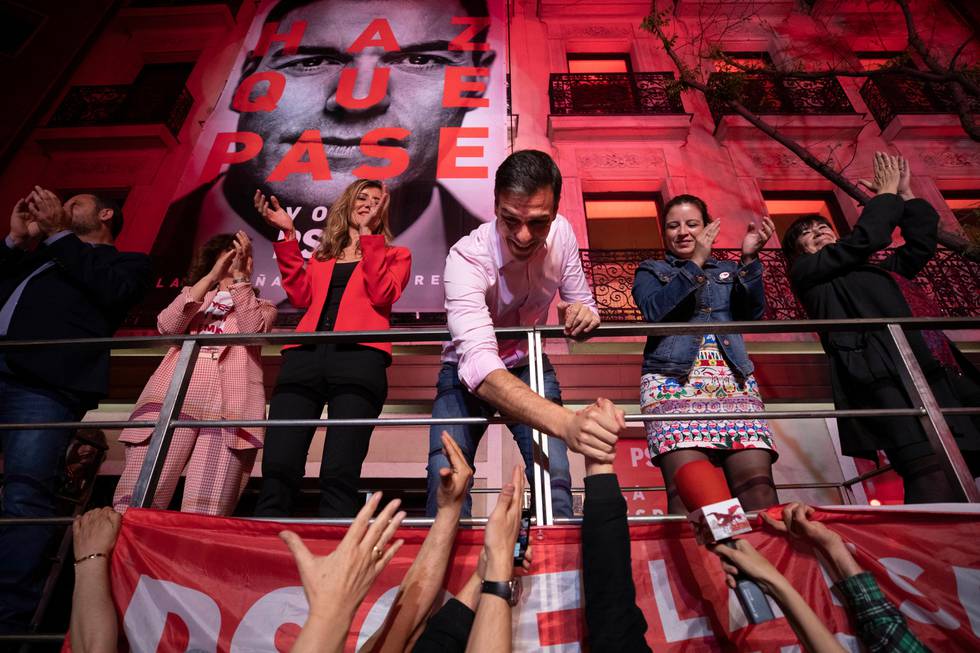 Spain's Prime Minister and Socialist Party leader Pedro Sanchez shakes hands with supporters outside the party headquarters following the general election in Madrid, Spain, Sunday, April 28, 2019. (AP Photo/Bernat Armangue)