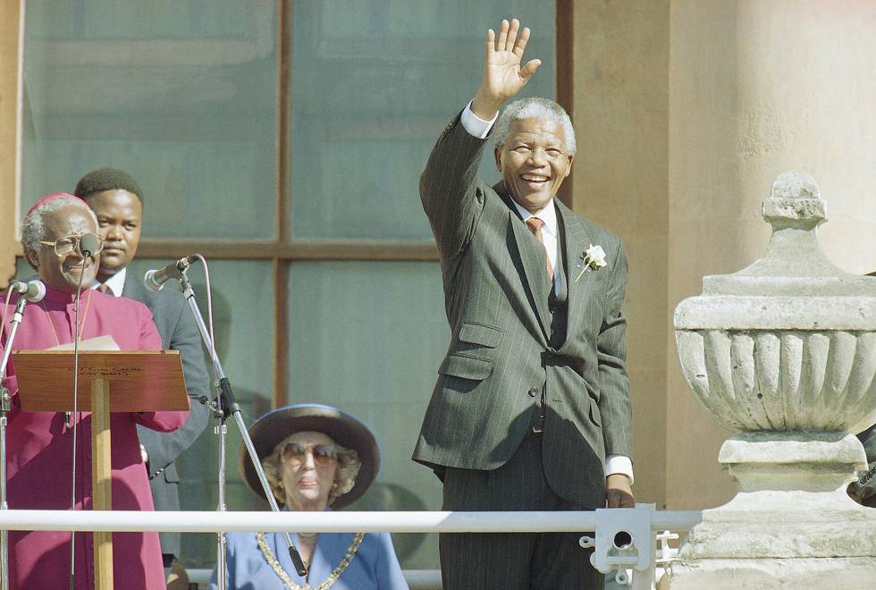 A smiling Nelson Mandela, South Africa's President-elect, waves to the large crowd gathered on the Grand Parade in Central Cape Town Monday May 9, 1994. Mr. Mandela, who is to be formally inaugurated on Tuesday, earlier pledged his allegiance in parliament. (AP Photo/Lynne Sladky)