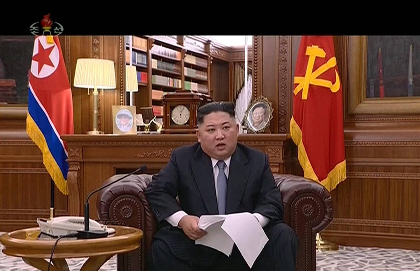 In this undated image from video distributed on Tuesday, Jan. 1, 2019, by North Korean broadcaster KRT, North Korean leader Kim Jong Un delivers a speech in North Korea. Kim says he hopes to extend his high-stakes nuclear summitry with President Donald Trump into 2019, but also warns Washington not to test North Koreans' patience with sanctions and pressure. Kim also during his New Year's speech said the United States should continue to halt its joint military exercises with ally South Korea. Nuclear talks between the countries have stalled.(KRT via AP)
