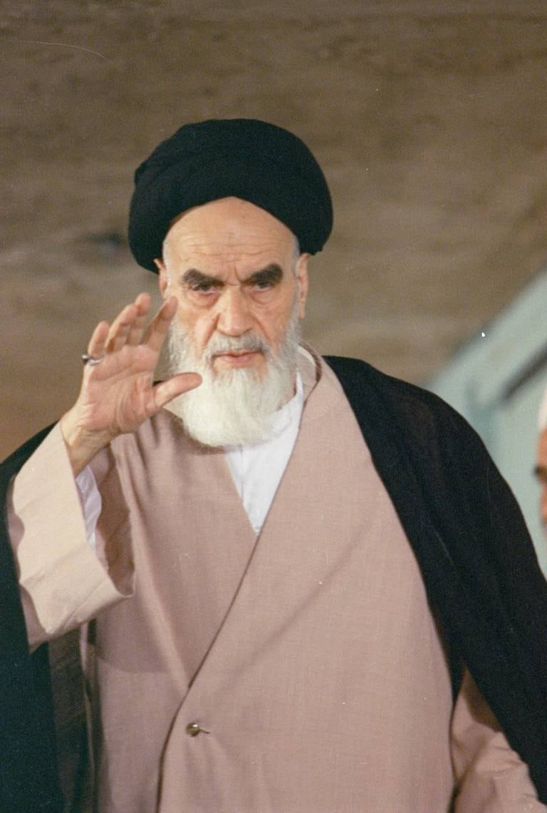 FILE -- In this May 13, 1988 file photo, then Iranian leader Ayatollah Ruhollah Khomeini greets well-wishers before casting his vote in the final round of Iran's Parliamentary Elections.  In August, 2016, a website in Grand Ayatollah Hossein Ali MontazeriÄôs honor, run by his family, released a tape recording of Montazeri that has rekindled memories of the Islamic RepublicÄôs mass execution of prisoners in 1988. The recording has Montazeri condemning IranÄôs execution of thousands of prisoners at the end of the countryÄôs bloody war with Iraq in 1988. He warns those gathered theyÄôve committed Äúthe biggest crime in the history of the Islamic Republic,Äù while criticizing them for misleading the countryÄôs then-ailing supreme leader, Ayatollah Ruhollah Khomeini. (AP Photo/Sayaad, File)